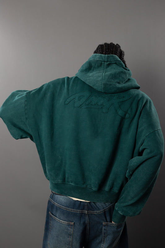 POLERA CON CAPUCHA TORNIQUET